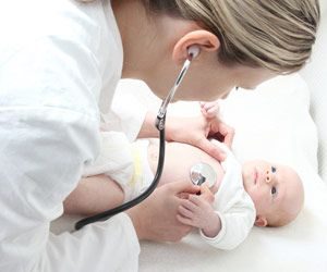 Nurse checking baby