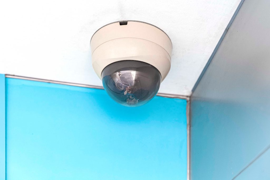 Ceiling-mounted surveillance camera representing secret recordings and patient privacy violations