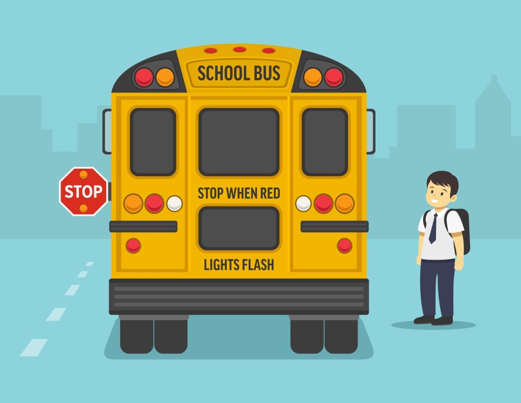 Señal de tráfico que advierte sobre niños esperando el autobús escolar