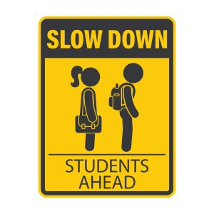 Traffic sign warning of children waiting for school bus 