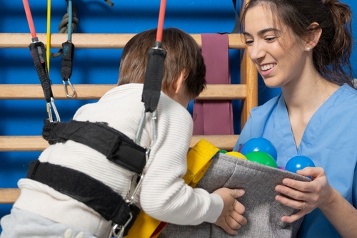 Child receiving therapy for cerebral palsy birth injury