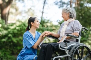 Person in a wheelchair receiving support after a catastrophic injury
