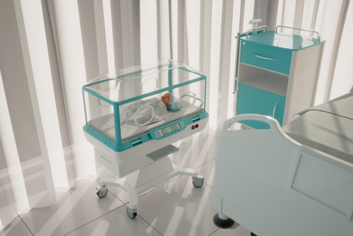 Newborn baby in hospital incubator for birth injury page