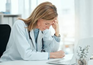 Attorney reviewing medical records after possible medical malpractice
