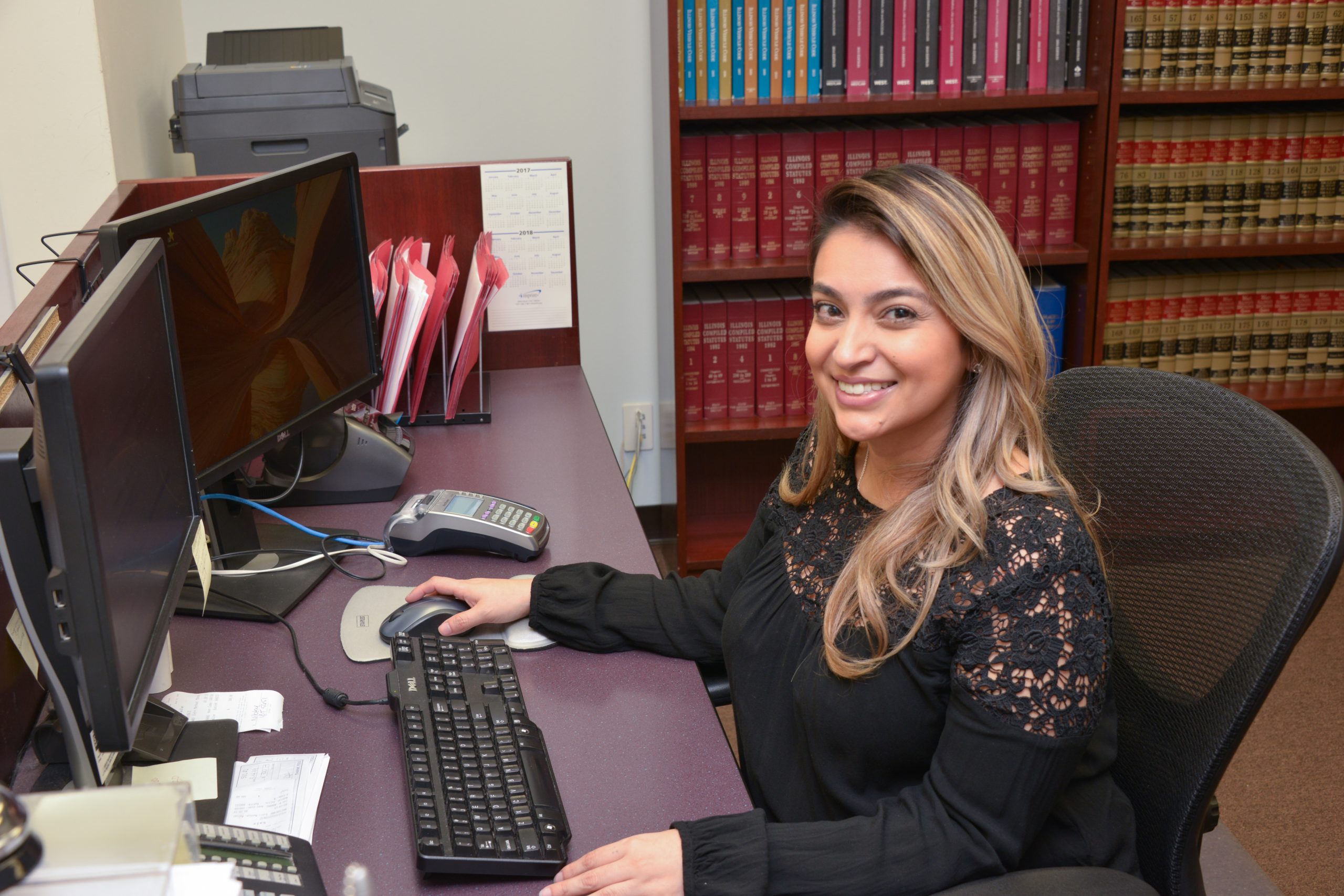 Sexner Injury Lawyers LLC staff member working at an office computer