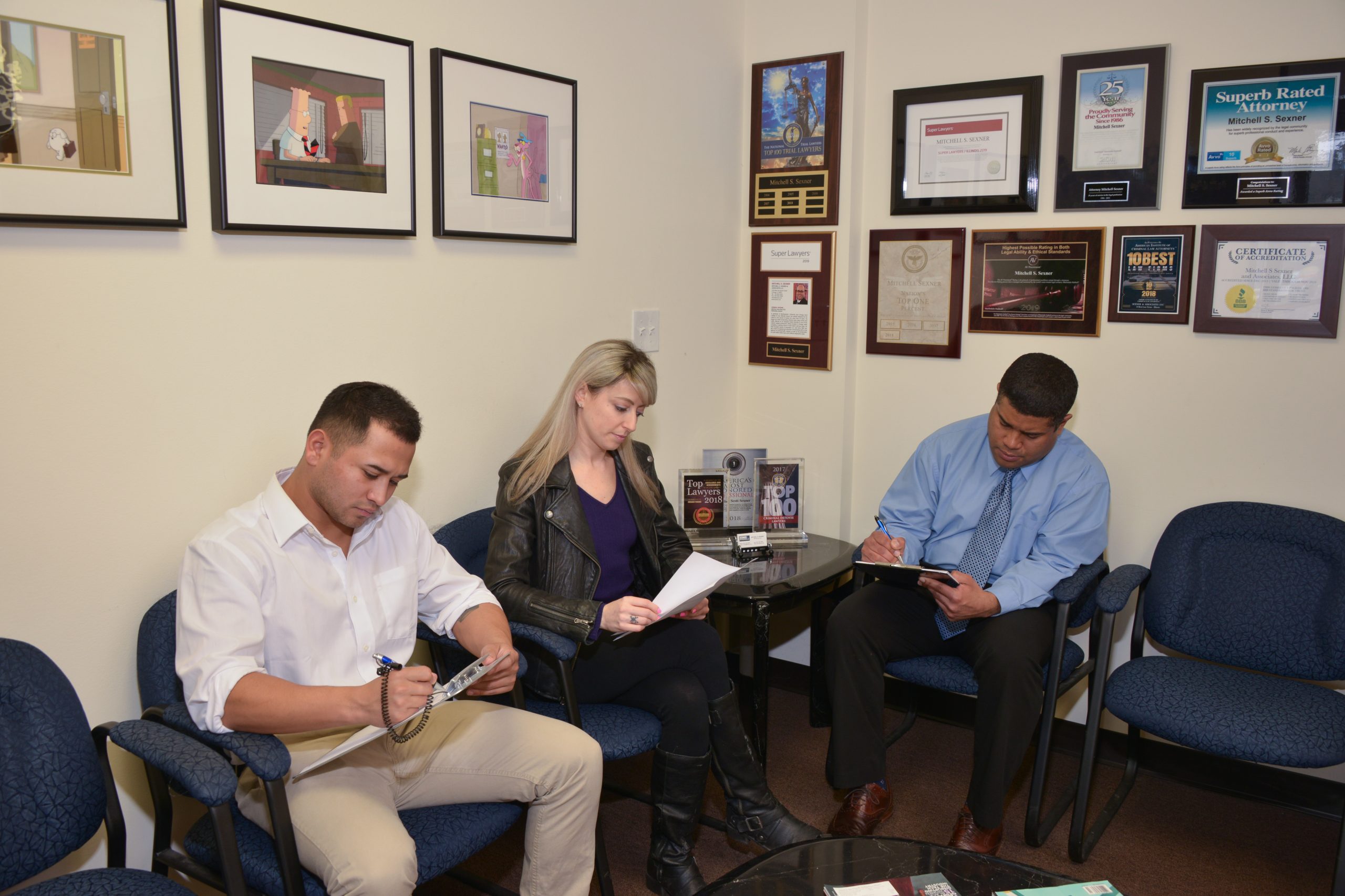 Clients completing paperwork in the Sexner Injury Lawyers LLC waiting room