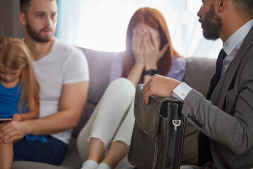 Grieving family meeting with lawyer after wrongful death of loved one