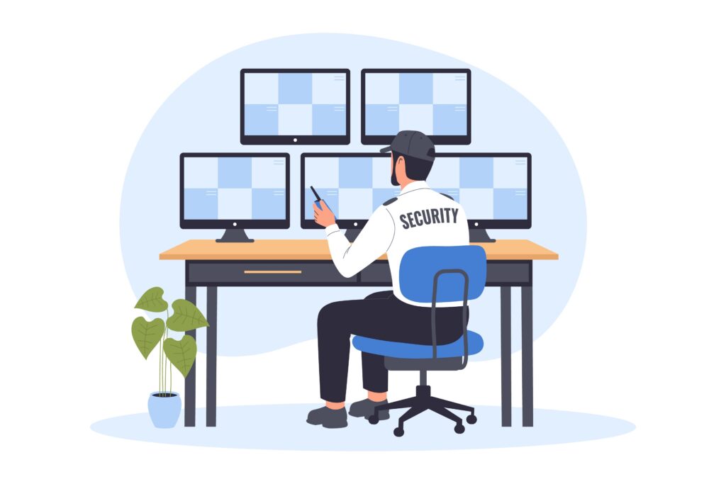 Security guard monitoring multiple surveillance camera screens while seated at a security desk.